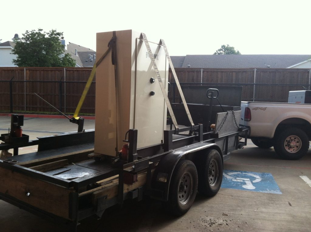 Fort Knox gun safe strapped to our safe moving trailer attached to our truck