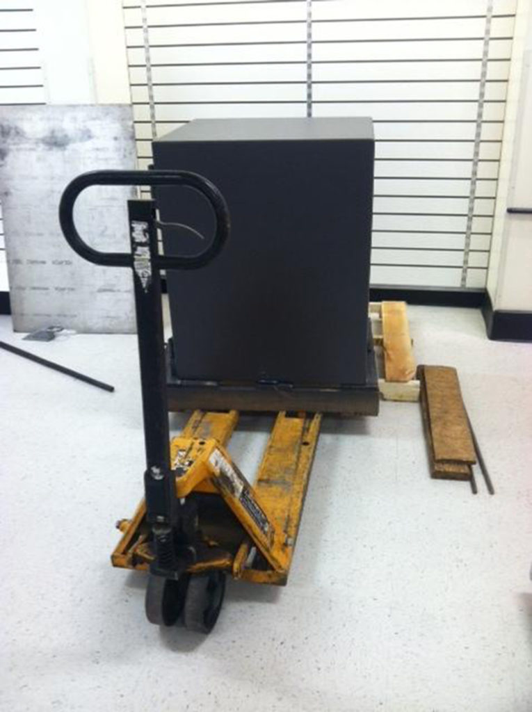 removing a Meilink safe from pallet with pallet jack 1