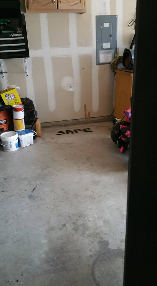 safe written on concrete in garage where the Cabela's safe will be placed
