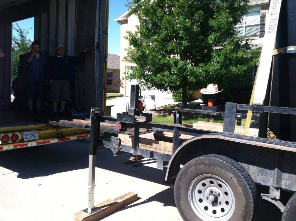 Our safe moving trailer raised up level with a tractor trailer and the gun safe moved onto our trailer
