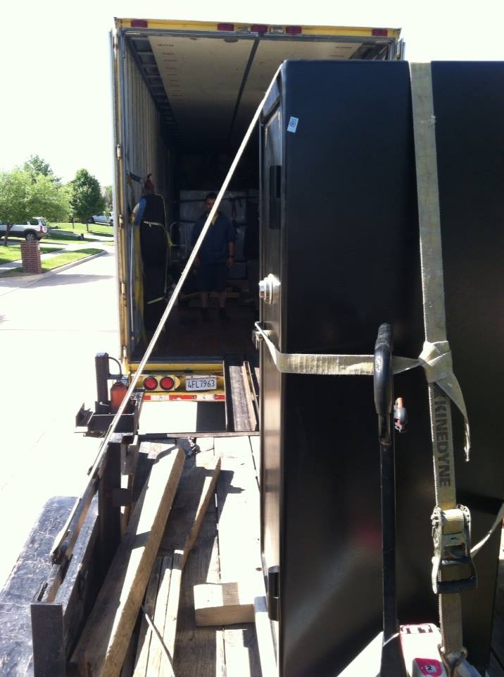 Our safe moving trailer raised up level with a tractor trailer and the gun safe moved onto our trailer 2