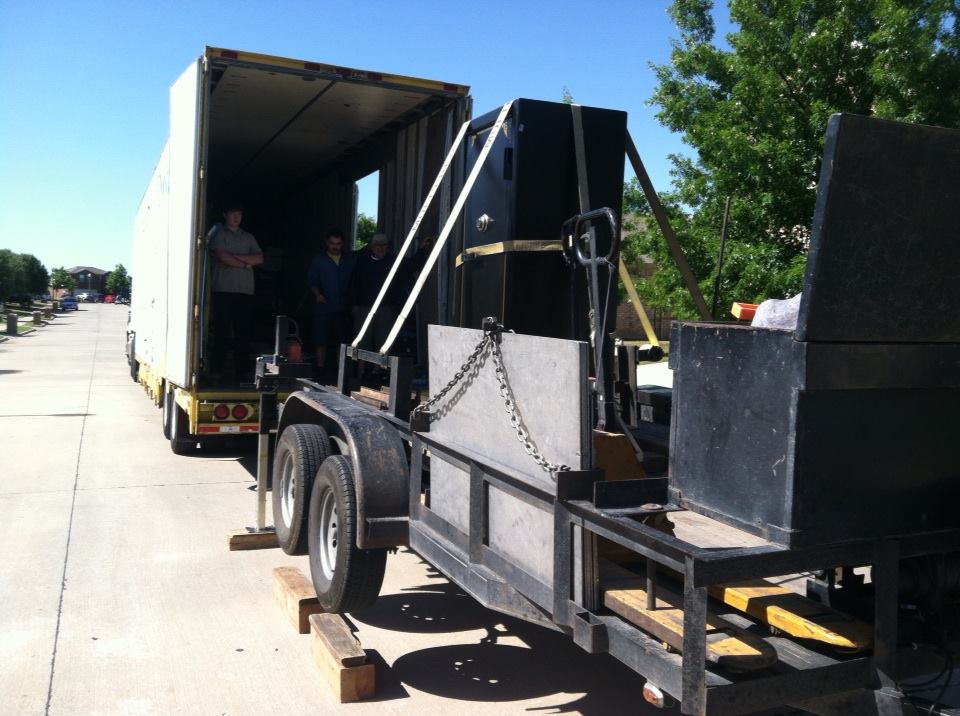 Our safe moving trailer raised up level with a tractor trailer and the gun safe moved onto our trailer 3