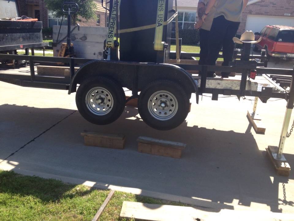 Our safe moving trailer raised up level with a tractor trailer and the gun safe moved onto our trailer 4